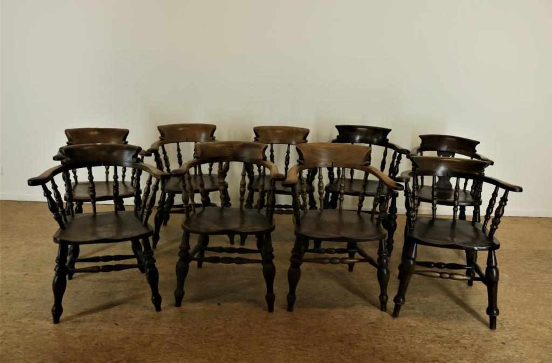 a set of 9 elm bow-back Captains chairs, England ca. 1870.