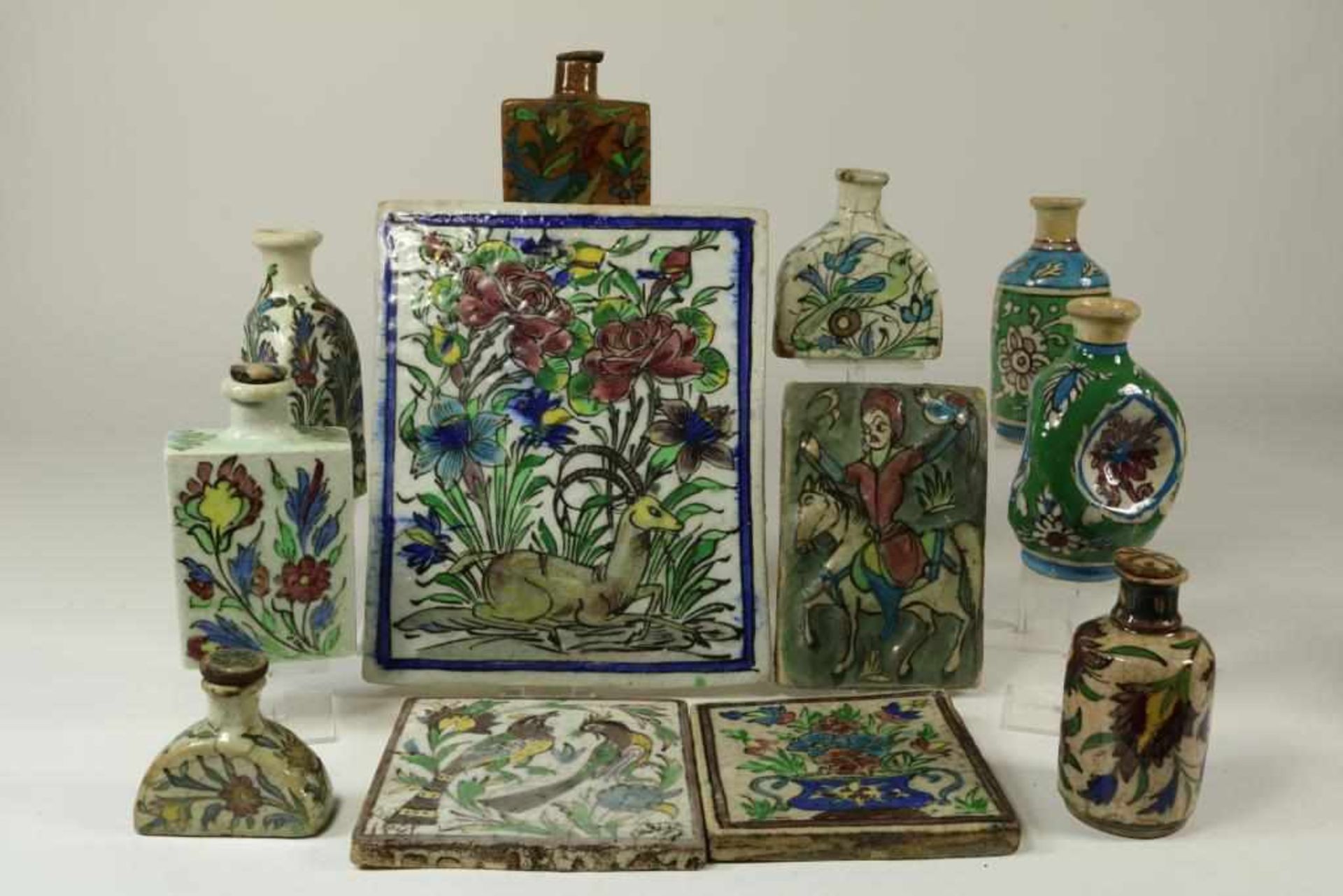 A collection of Persian pottery, with tiles and jugs, ca. 1920