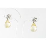 A pair of white gold earrings with citrine