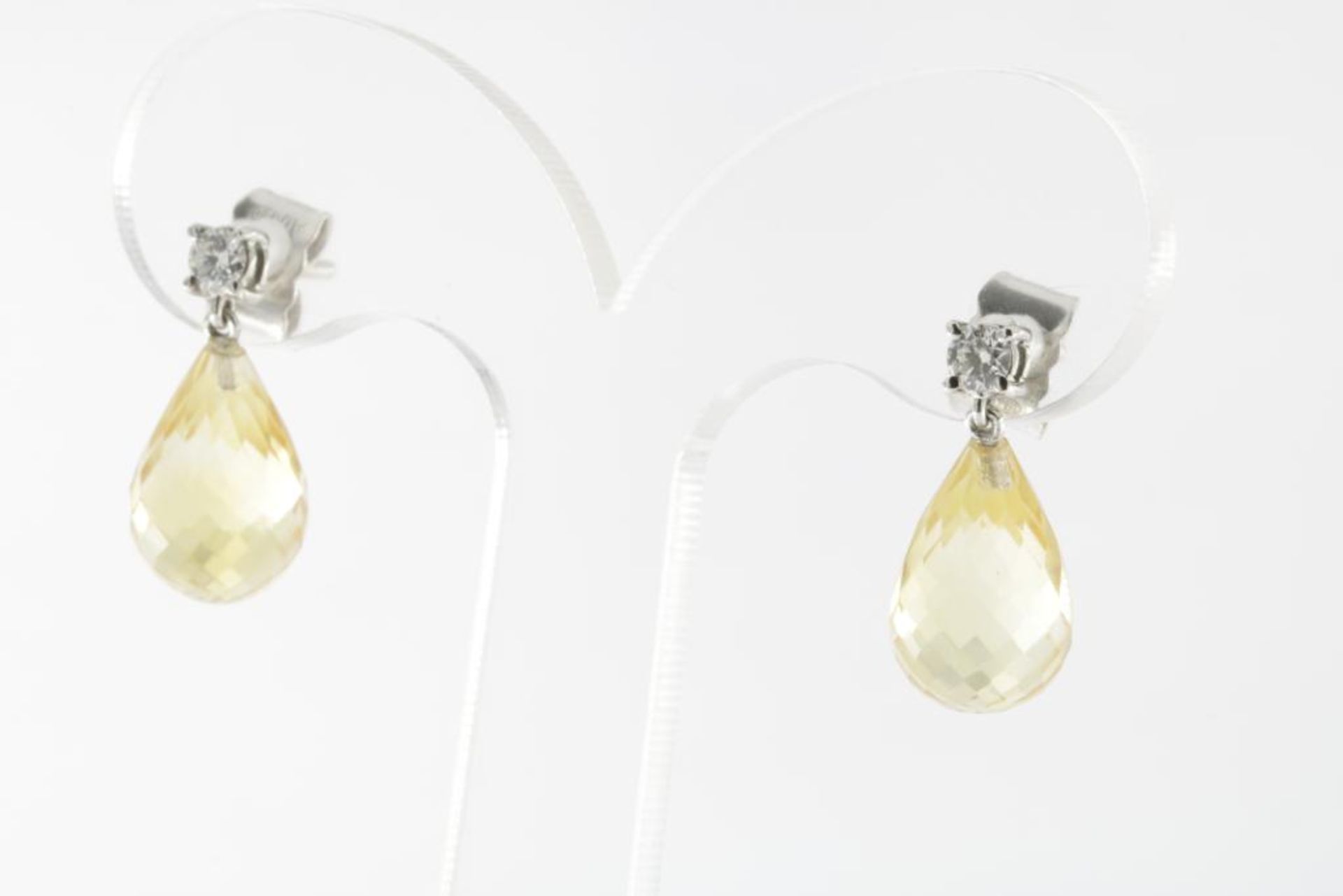 A pair of white gold earrings with citrine