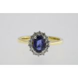 A bi color gold dress ring mounted with sapphire and diamonds, 750/000 size 16.5