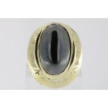 A yellow gold ring with hematite