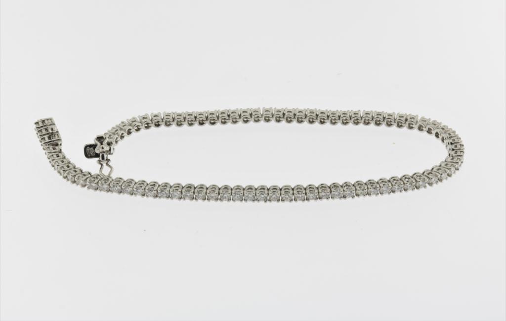 A white gold tennis bracelet mounted with brilliant cut diamonds, SI, P, G, total 2.74ct, 750/000, - Image 2 of 2