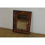 Geslepen spiegel in (faux turtles) celluloid lijst, 72 x 57 cm.