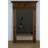 Mirror in oak frame with carved mask and leaves, ca. 1910 (mirror of later age), 146 x 93 cm.Spiegel