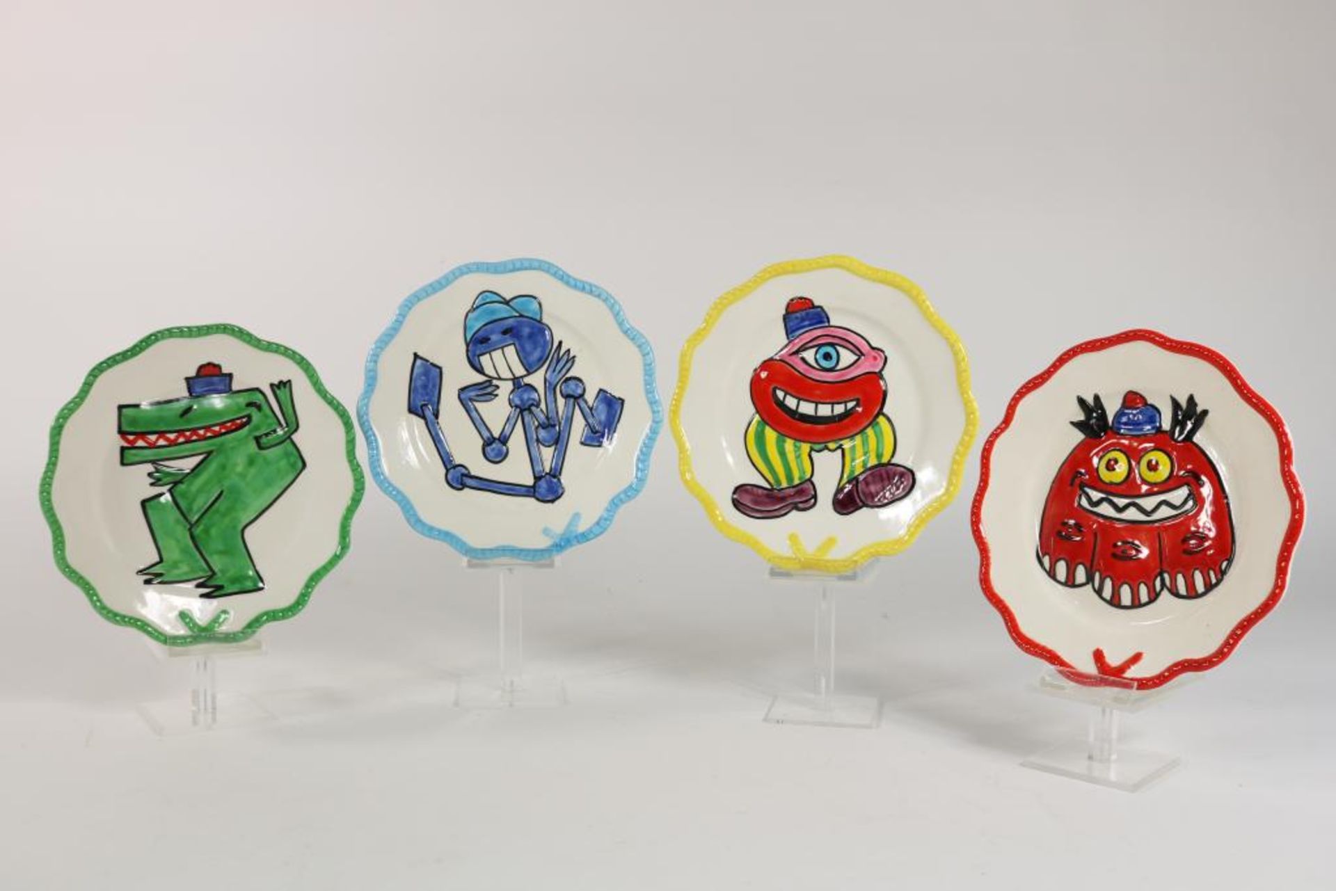 Series of 4 ceramic plates with polychrome presentation of fantasy figures, design Herve Di Rosa (