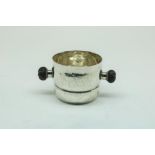 A beaded silver sugar jar with ebony handles, possibly model no 80F, mm George Jensen, Denmark,