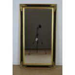 Cut mirror in black and gold lacquer frame, 140 x 80 cm.Geslepen spiegel in zwart en goudlak