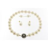 A cultivated South Sea pearl necklace with antique yollw gold and silver lock set with diamonds,