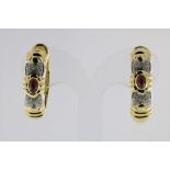 A set of yellow and white gold creools with cabochon cut ruby and diamond, 750/000, gross w. 26gr,