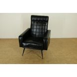 Armchair with black leather covered on metal legs.Armfauteuil met zwartleer bekleed op metalen