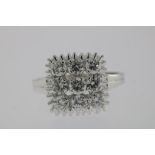 A white gold ring set with nine diamonds set in carree, total 0.90ct, 750/000, gross w. 5.0gr, seize