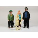 Lot of 4 Tintin dolls.Lot van een plastiek Kuifje, kapitein Haddock, professor Zonnebloem, h. 24 cm.