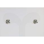 A set of white gold solitair earrings set with brilliant cut diamonds, total ca. 0.54ct, clarity