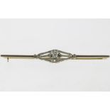 A yellow and white gold barbrooche set with diamonds, Art Deco, 585/000, gross w. 4.4gr, length 6.