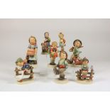A collection of 8 hummel sculptures, boys and girls, markded Goebel (1x restored)Lot van 8