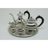 A silver tea and coffeeservice, Dutch, mm D.Aubert, 835/000, gross w. 1789gr, length tray 33cm.Een