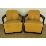 Set design chairs with ocher yellow leather upholstery and wooden armrests, Calia Italy label.Stel