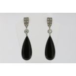 A pair of white gold dropearrings set with old cut diamonds and onyx, 585/000, gross w. 10.7gr,