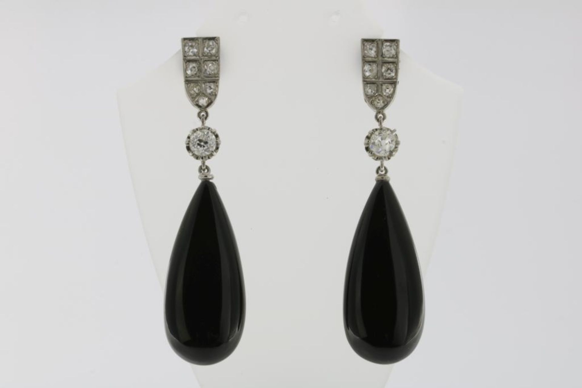 A pair of white gold dropearrings set with old cut diamonds and onyx, 585/000, gross w. 10.7gr,
