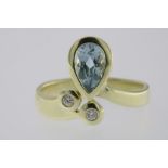 A yellow gold fantasy ring set with diamonds and a pear shaped aquamarine, 585/000, gross w. 6.