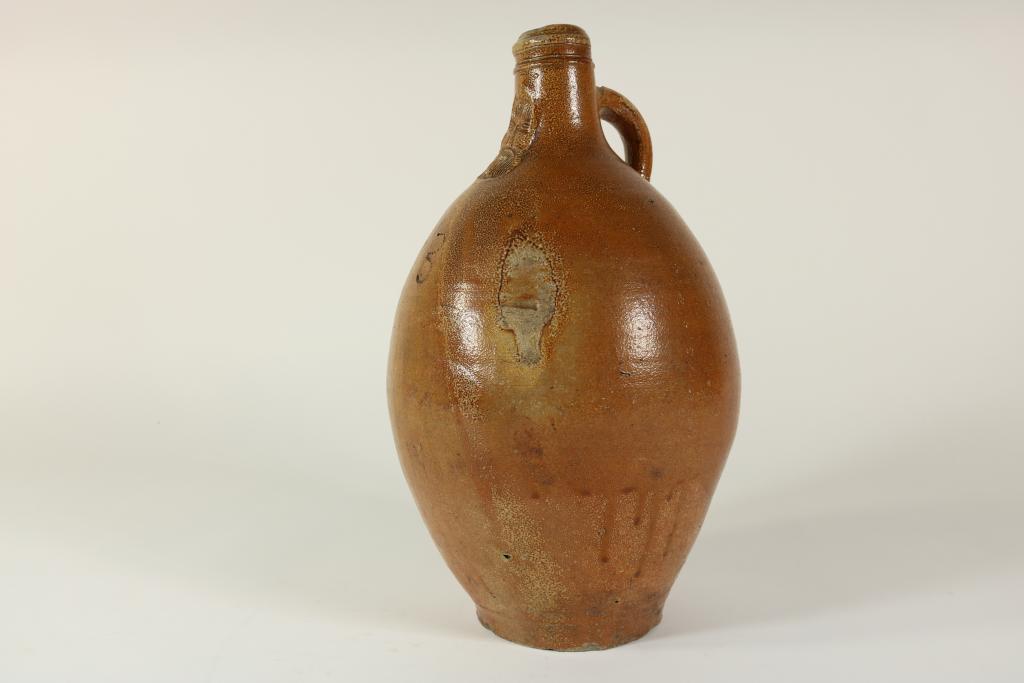 Stoneware bellarmine (beardman) jug, Frechen 18th century, h. 41 cm.Steengoed baardman kruik,