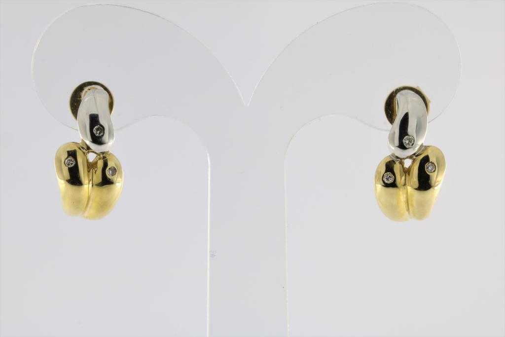 A pair of white and yellow gold earrings set with diamonds, 585/000, gross w. 6gr, length 1.5cm.