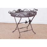 Wrought iron side table with open worked oval top with handles, h. 66, w. 81, d. 54 cm.