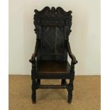 Oak wainscott chair with carving to the back, England 17th century.Eiken rijkgestoken armstoel, zgn.