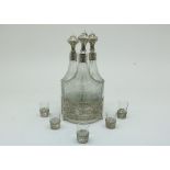 A silver liquor set, three etched carafs and 5 div. glasses, Dutch, retailers mark fa. Dahlia,