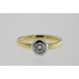 A modern yellow and white gold solitair ring set with a brilliant cut diamond, 0.25ct, 750/000,