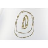 A yellow gold necklace and three string bracelet, gross w. 26gr, length bracelet 19cm. defects.Een