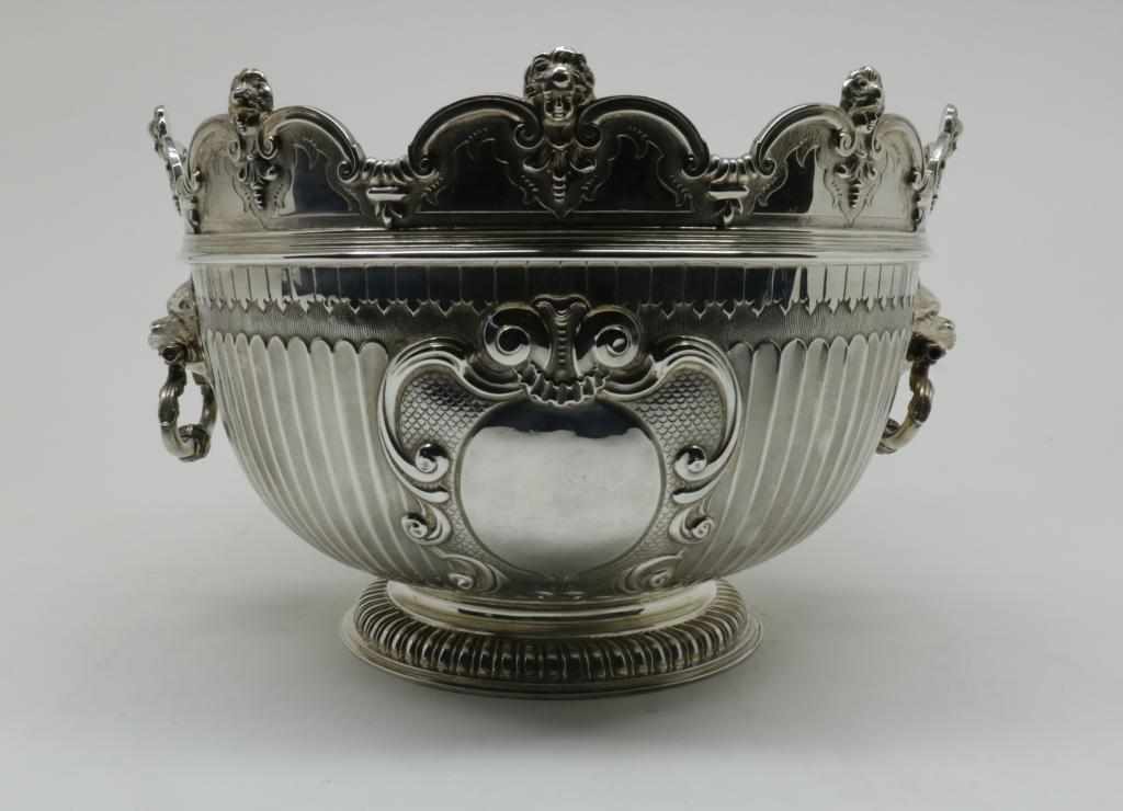 A sterling silver monteith or cooler, decorated with two cartouche medaillons, mascarons at the