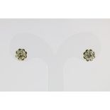 A set of yellow gold solitair earrings set with brilliant cut diamonds, total ca. 0.96ct, clarity