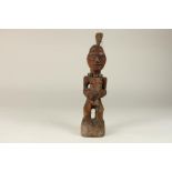 Songye, D. R. Congo, sculpture of a male, nkisi power figure, with a black horn on its head,