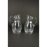 Pair of crystal wine jugs, h. 28 cm.Stel kristallen waterkannen met olijfslijpsel, h. 28 cm.