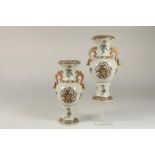 Pair of 2 Famille Rose vases decorated with cotes of arms, marked with 4 characters, h. 27 cm.Stel