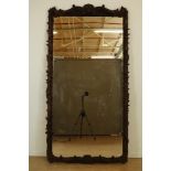 Mirror in oak carved frame, 19th century, 212 x 113 cm.Kapitale schouwspiegel gevat in eiken