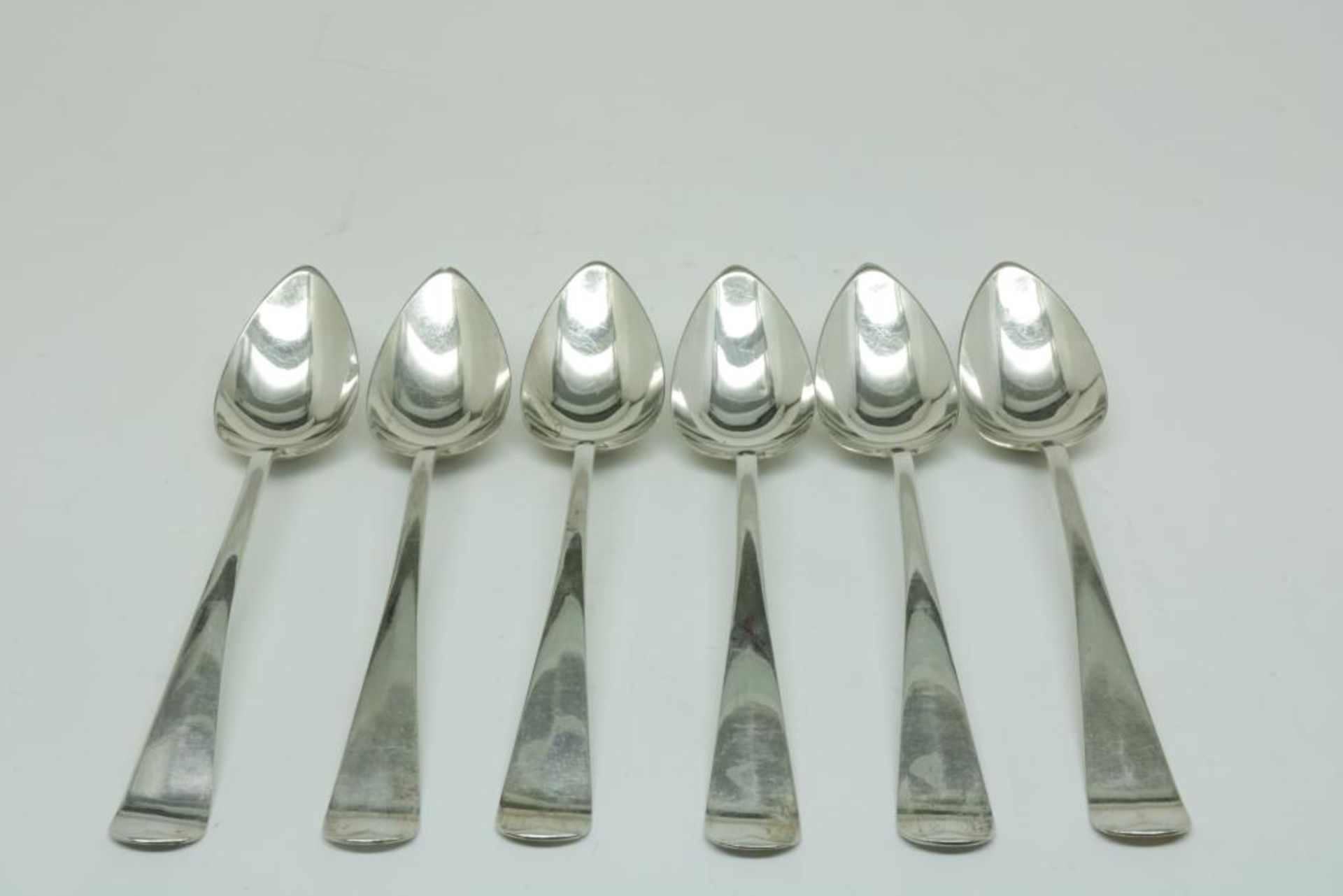 Six silver spoons, Dutch 1918, 835/000, gross w. 343gr, length 21cm.Zes zilveren lepels, Haags