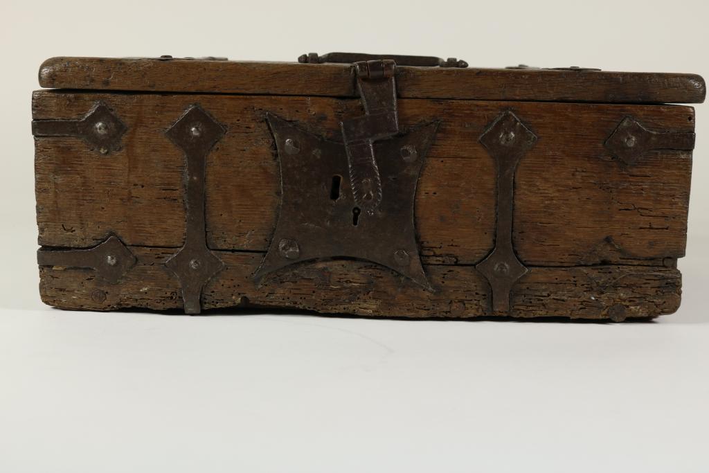 Oak small money trunk with iron, 17/18th century.Eiken geldkist met ijzeren banden en slotplaat,