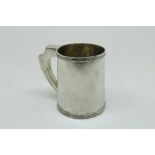 A silver tankard, 835/000, gross w. 268gr, height 10cm.Een zilveren pul, 835/000, br.gew. 268gr,