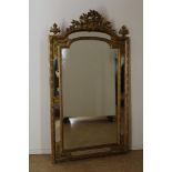 Antique mirror in gold frame decorated with bird in crest flanked by a set of urns, h.162, width