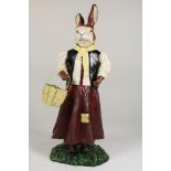 polychrome cast iron sculpture of bunny in dress with a baskey, h. 50 cm.Polychrome gietijzeren