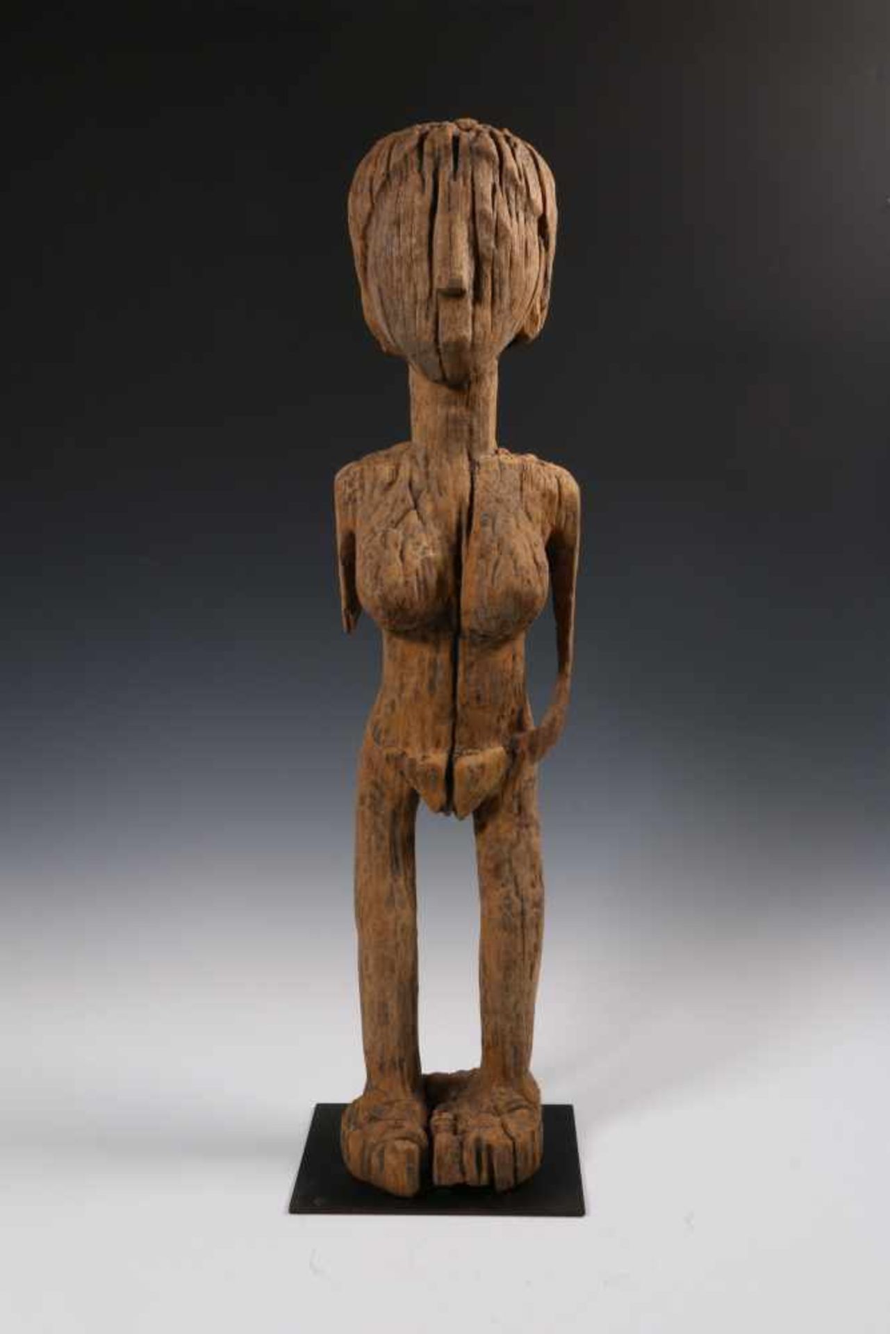 Madagascar, Vezo, camphor wooden grave figurein the form of a standing female figure. Bought in