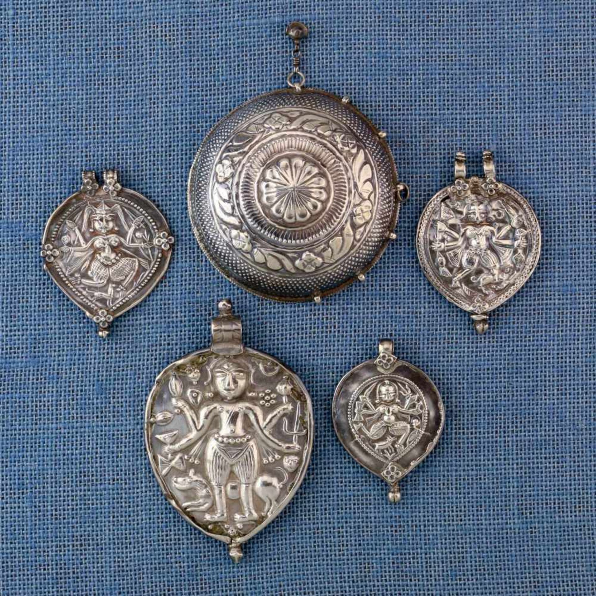 India, Himachal Pradesh, Rajasthan and Gujarat, silver back ornament and four silver amulets"chak"