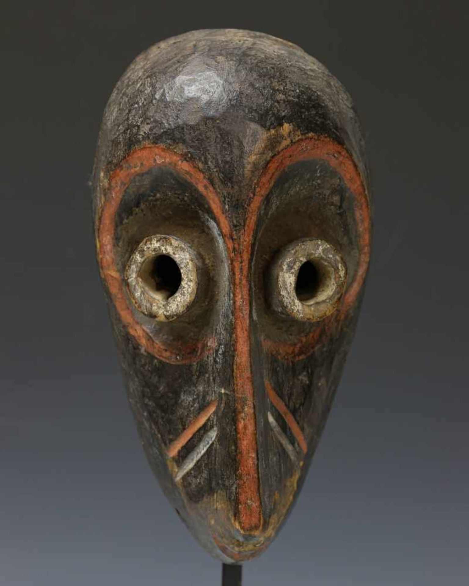 Pende, small maskwith tubular eyes and red, black and white pigment. Private collection Berlin, h.