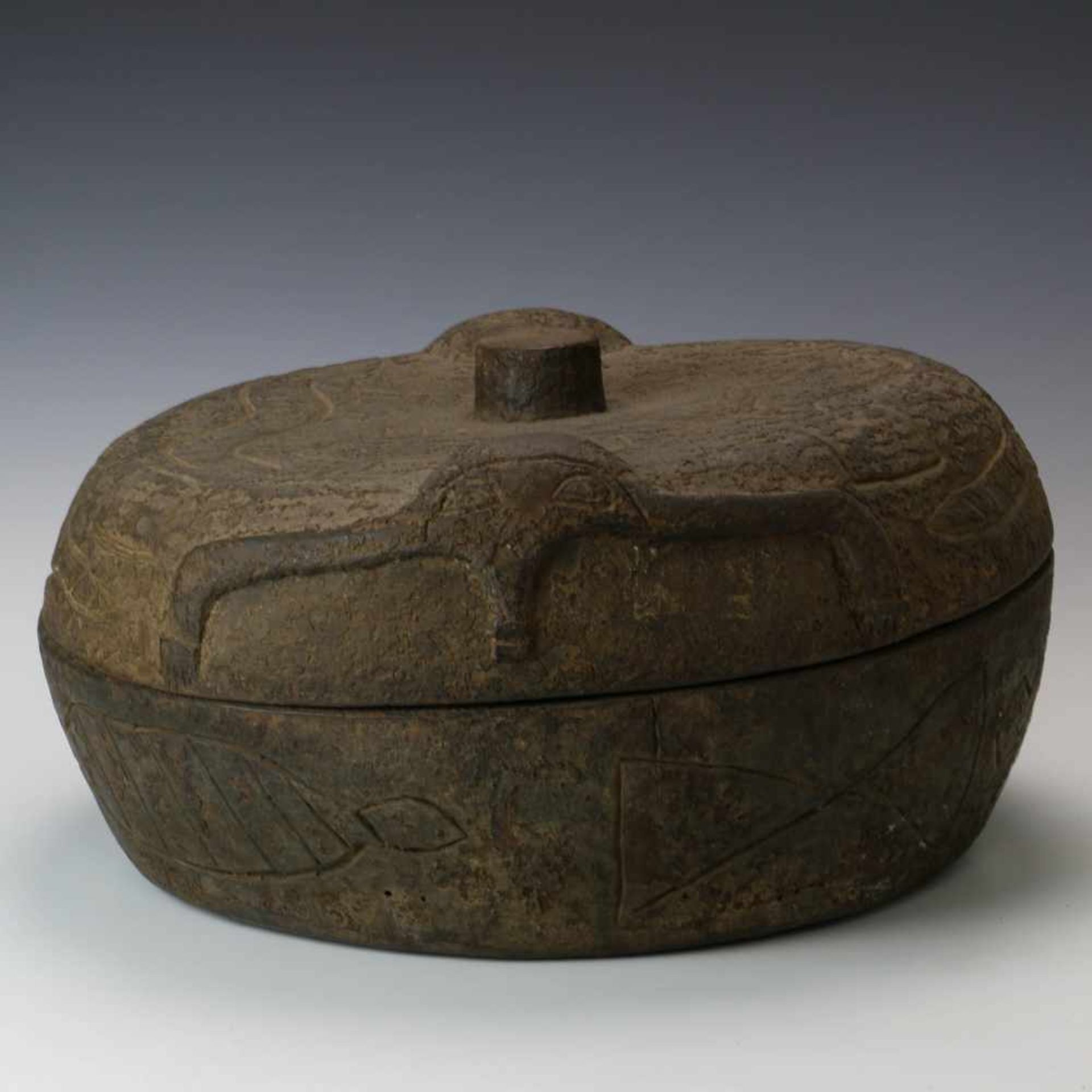 Yoruba, kola nut wooden boxwith carved animals and two anthropomorphic figures in relief. With