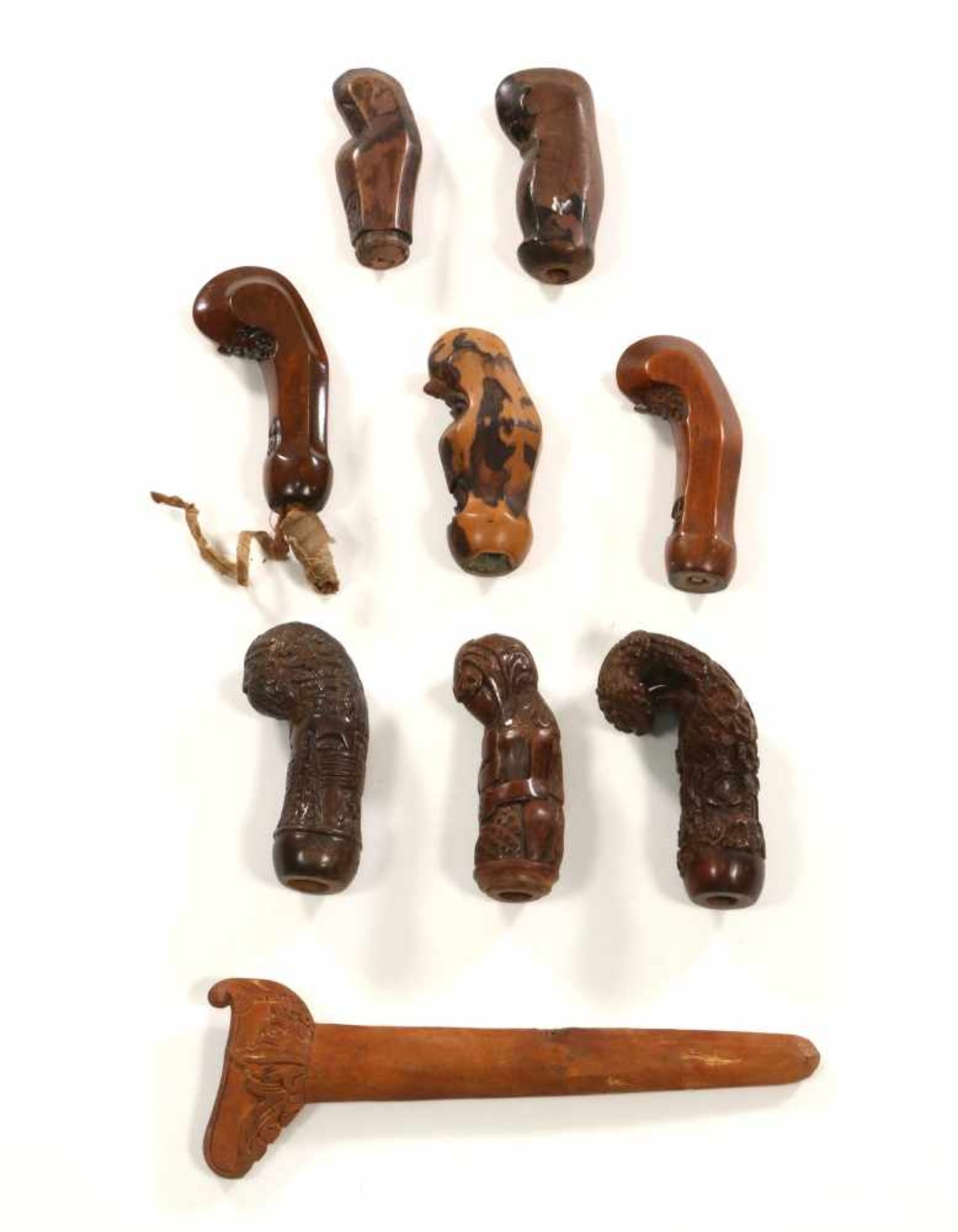Indonesia, eight wooden keris handles and one sheath., [zk]200