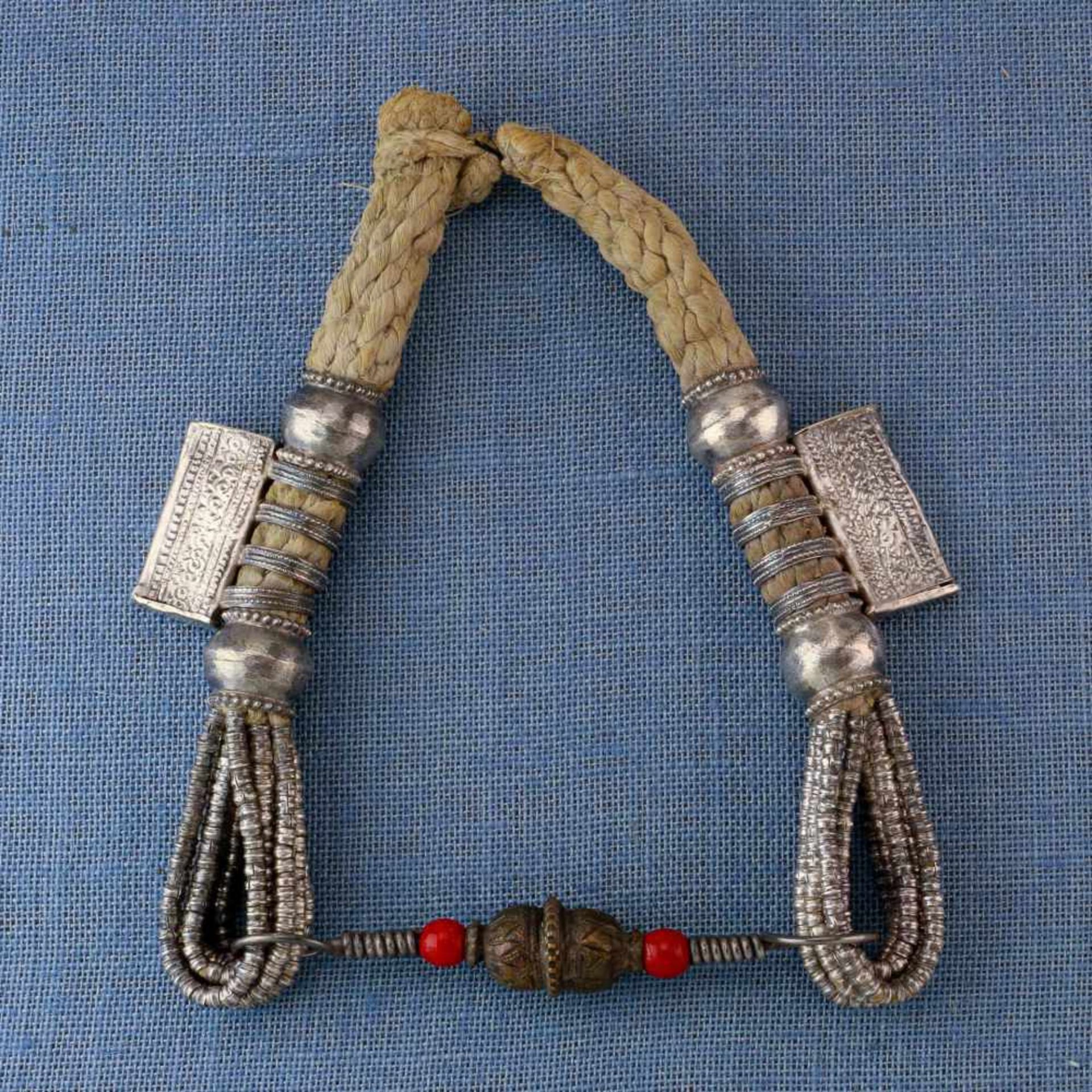 Oman, copper alloy amulet necklace, 'Digg'with two red beads, two amulet holders and twisted