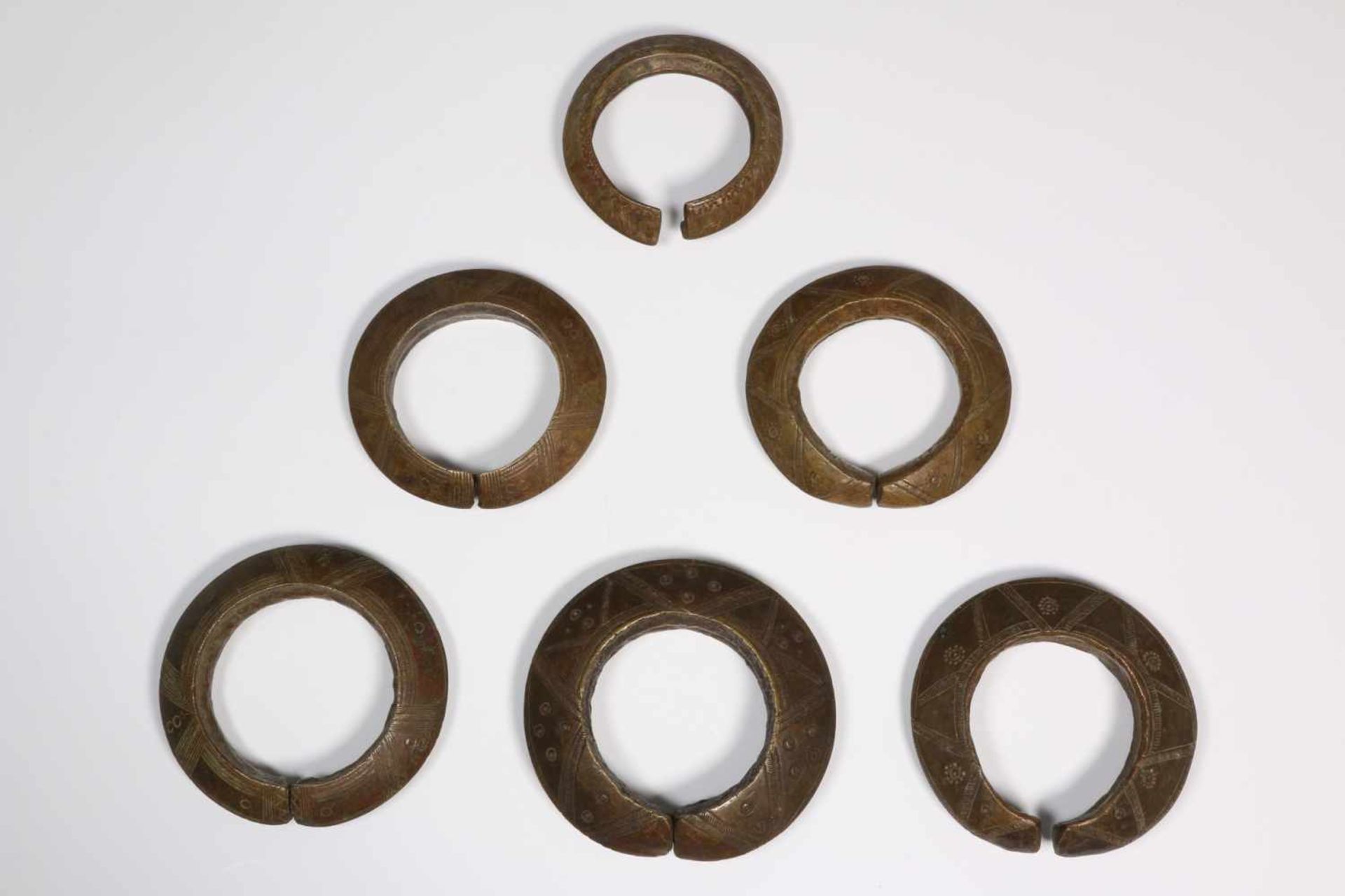 Sumba, six copper braceletsdecorated with geometrical patterns, [zk]80